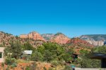 A view of the home backdropped by stunning Sedona views